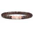 Detailed close-up of brown wooden spacer beads bracelet with natural stone round center beads. - No. 26