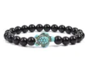 Black beaded bracelet featuring a charming turquoise turtle pendant detail for daily wear. - Black