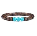 Close-up detail of wooden disc spacer beads paired with three vibrant blue turquoise beads. - No. 19
