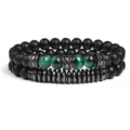 Close-up detail of double layer beaded bracelet with green tiger eye and black stone. - Style 5