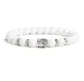 Detailed view of the 8mm white bead bracelet featuring a silver Buddha head charm. - White Beads