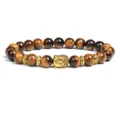 Detail shot of natural tiger eye stone beaded bracelet with golden Buddha head charm and spacers. - Tiger's Eye