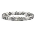 Detail shot of grey stone beaded bracelet with silver Buddha head charm and metal spacer accents. - Grey Textured Beads