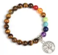 Natural tiger eye stone and chakra bead bracelet featuring a silver tree of life metal pendant. - Style 29