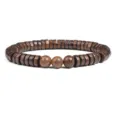 Close-up detail of natural wood beaded bracelet showing unique grain pattern and texture. - Size 8