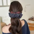 Korean style floral ruffle banana clip with brown satin bow on long wavy hair - Floral Style / Blue