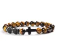 Detail view of 8mm yellow tiger eye and lava stone bead bracelet with a black cross charm. - 7