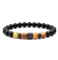 Close-up detail of beaded gemstone bracelet with black stones and paved zircon charm. - Yellow Tiger's Eye (11)