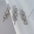 Macro detail of three elegant silver-toned hair clips with clear sparkling rhinestones - Short Clip Single