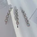 Detailed view of three silver alloy hair clips set with sparkling clear rhinestones - Long Clip Single