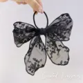 Elegant black lace bow hair tie with delicate floral embroidery and elastic band - Black Lace Bow