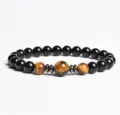 Detailed close-up of natural stone beaded bracelet with tiger eye and black beads. - Finished Bracelet Elastic approx 20cm / Tiger's Eye