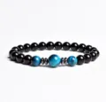 Detailed view of the beaded bracelet with black and blue stones and metallic spacers. - Finished Bracelet Elastic approx 20cm / Blue Tiger Eye