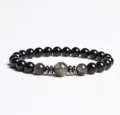 Detailed view of an 8mm black beaded gemstone bracelet with metallic spacers for daily wear. - Finished Bracelet Elastic approx 20cm / Silver Sheen Obsidian