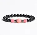 Close-up detail of the beaded bracelet featuring black and pink stones with metallic spacers. - Finished Bracelet Elastic approx 20cm / Pink Chalcedony