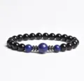Bead bracelet detail view featuring black and blue polished gemstone beads and metal spacers. - Finished Bracelet Elastic approx 20cm / Blue