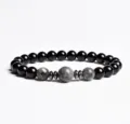 Detailed view of beaded bracelet with black onyx, grey stone beads and metallic spacers. - Finished Bracelet Elastic approx 20cm / Gray Spotted Stone