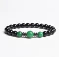 Detailed view of 8mm black and green stone beaded bracelet with elegant metal spacers. - Finished Bracelet Elastic approx 20cm / Unakite