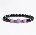 Detail view of an 8mm black and purple beaded bracelet with metallic spacers for daily wear. - Finished Bracelet Elastic approx 20cm / Purple Chalcedony