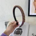 Elegant burgundy PU leather headband featuring a woven golden alloy chain detail - Burgundy