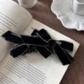 Elegant vintage black velvet bow hair claw clip with white dotted stitch detailing. - Banana Clip