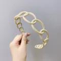 Chic cream beige plastic chain-link headband featuring non-slip teeth for secure styling - Beige