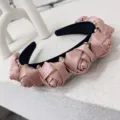 Elegant pink satin rose headband with sparkling rhinestone accents in a romantic style - Pink