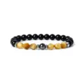 Close-up detail of the faceted tiger eye and black bead bracelet, showing exquisite texture. - 14