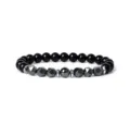 Close-up detail of the black beaded bracelet featuring faceted hematite and round stone beads. - 15