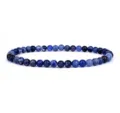 Close-up detail of blue gemstone beaded bracelet showcasing smooth round beads and natural textures. - Dark Blue