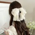 Grande pince à cheveux élégante en dentelle blanc cassé avec perles et rubans - Nœud en Dentelle et Perle Artificielle Blanc Cassé / Blanc Cassé