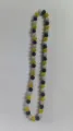 Detailed macro view showing the textured crystal clay beads of the Shamballa necklace - Gold Black AB White