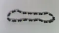 Detailed view of 10mm AB clay disco ball beads on an elastic Shambhala necklace bracelet. - Black White AB 3