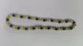 Close-up of 10mm Shamballa rhinestone clay beads in black, gold, and silver colors - Black Yellow Silver White