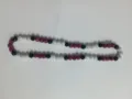Detailed macro view of 10mm rhinestone Shamballa beads in black, white, and magenta - Black White Rose Red