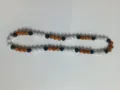 Macro detail view of 10mm rhinestone Shamballa beads in orange, black, and white colors - Orange Black AB White