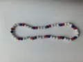 Detailed view of red white and blue Shamballa rhinestone beads on elastic necklace - 195 / Approx. 44 Beads, Approx. 51cm (20 Inches)