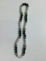 Close-up of 10mm Shamballa disco ball beaded necklace with green black and white crystals - Black Green AB White