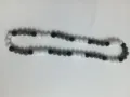 Close-up detail of a 10mm Shamballa disco ball necklace with black and silver pave beads. - Black Gray AB White
