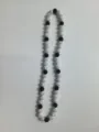 Close-up detail of 10mm AB rhinestone clay beads on a stylish Shamballa necklace - Black White AB 2
