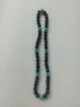Close-up view of 10mm Shamballa clay disco ball beads in black and turquoise blue - 95 / Approx. 44 Beads, Approx. 51cm (20 Inches)