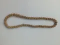 Close-up shot of 10mm sparkling golden rhinestone Shamballa beads on a clay jewelry necklace - 79 / Approx. 44 Beads, Approx. 51cm (20 Inches)