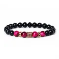 Detailed close-up of an 8mm cubic zirconia tiger eye and black stone beaded bracelet. - Style 29