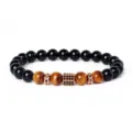 Close-up detail of beaded bracelet featuring tiger eye black stones and paved zircon spacers. - Style 25