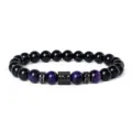 Natural stone beaded bracelet featuring purple tiger's eye and paved cubic zirconia spacers. - Style 22