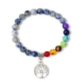 Detailed shot of the chakra stone beaded bracelet featuring a silver tree of life charm. - Style 3