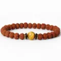 Detail shot of the Rudraksha and tiger's eye stone beaded bracelet, showing exquisite texture. - Style 4