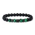 Detailed view of 8mm green tiger eye and black stone bracelet with micro-paved cubic zirconia. - Style 20
