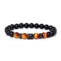Detailed view of a stylish beaded bracelet featuring tiger eye, onyx stones, and micro-paved zircon. - Style 17