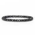 Detailed shot of 6mm faceted abacus black hematite bead bracelet, showing smooth cutting surface. - Faceted Abacus Beads